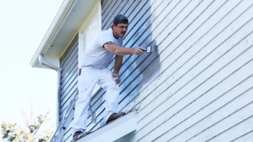 man doing residential exterior painting