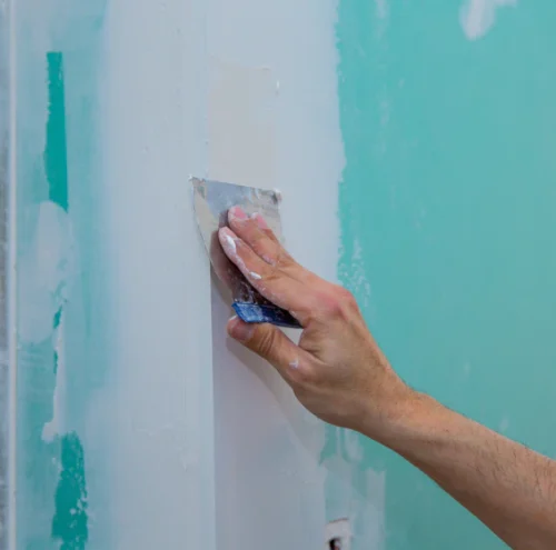 worker doing drywall service